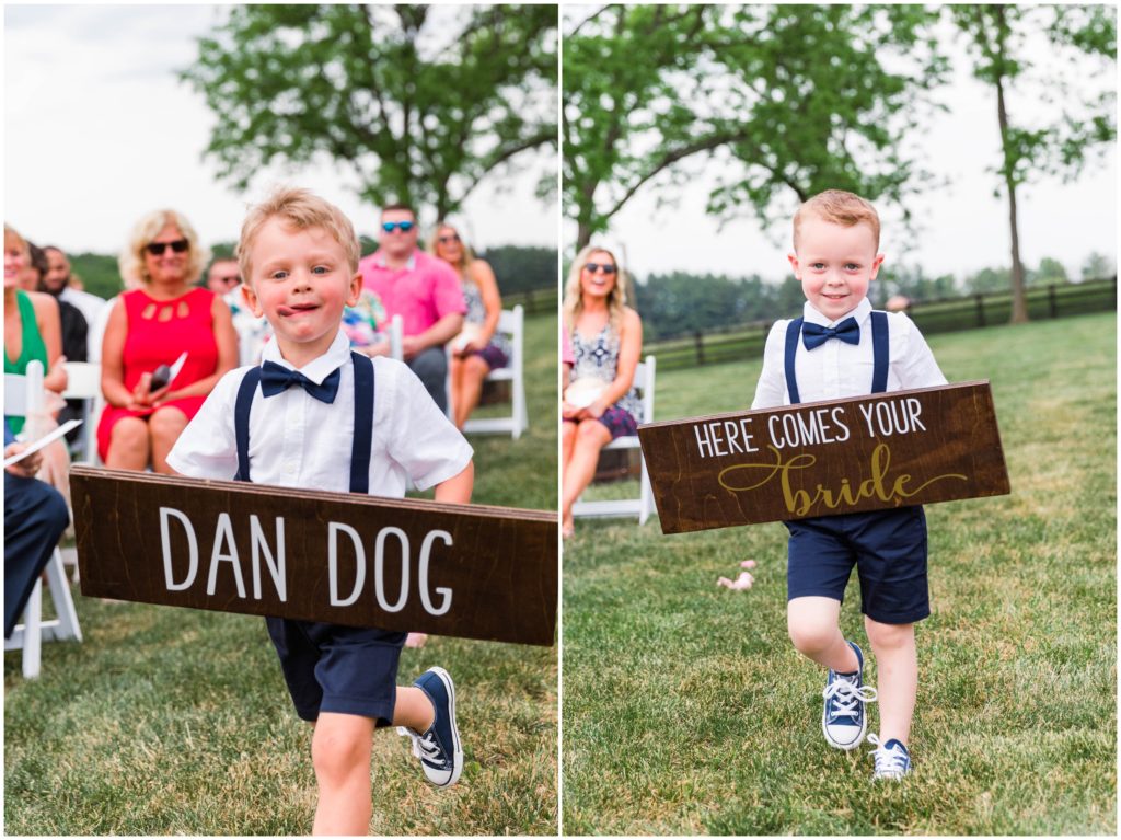 ring bearers holding signs